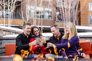 Group enjoying drinks at the Grand Colorado fire pit